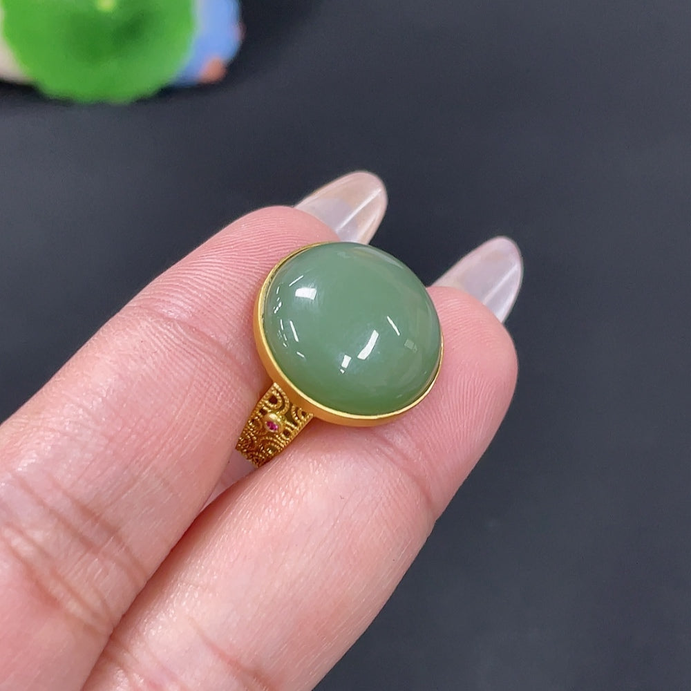 Huiliu HQ Hetian Jade Inlaid Ring featuring a polished jade gemstone and intricate silver band design.