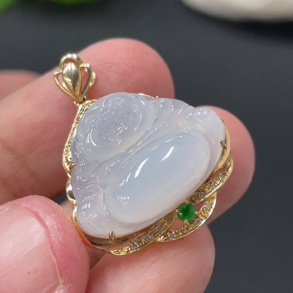 Huiliu Jadeite Buddha pendant with diamond accents, showcasing a detailed carved jade Buddha figure in a natural setting.