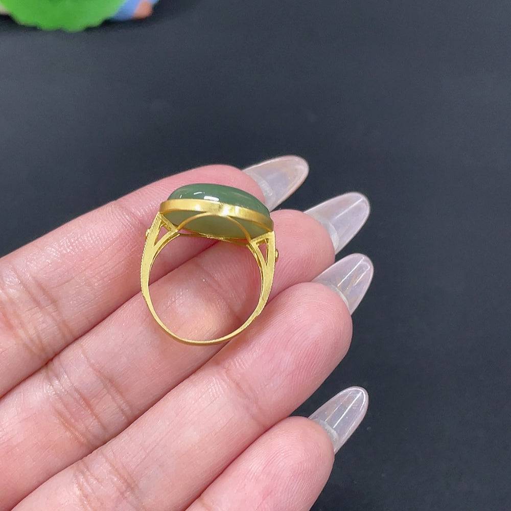 Huiliu HQ Hetian Jade inlaid ring featuring smooth jade gemstone and intricate metalwork, displayed on a neutral background.