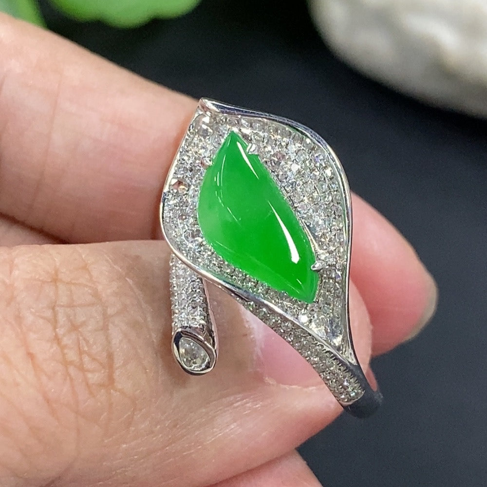 Jadeite freeform inlaid ring with 18K gold band and diamond accent, featuring a smooth, polished jadeite gemstone setting.
