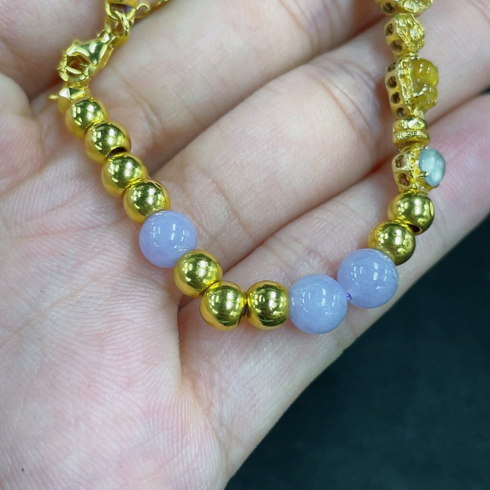 Jadeite bead bracelet with mixed gold components featuring smooth green jade beads and gold accents, stylish jewelry accessory