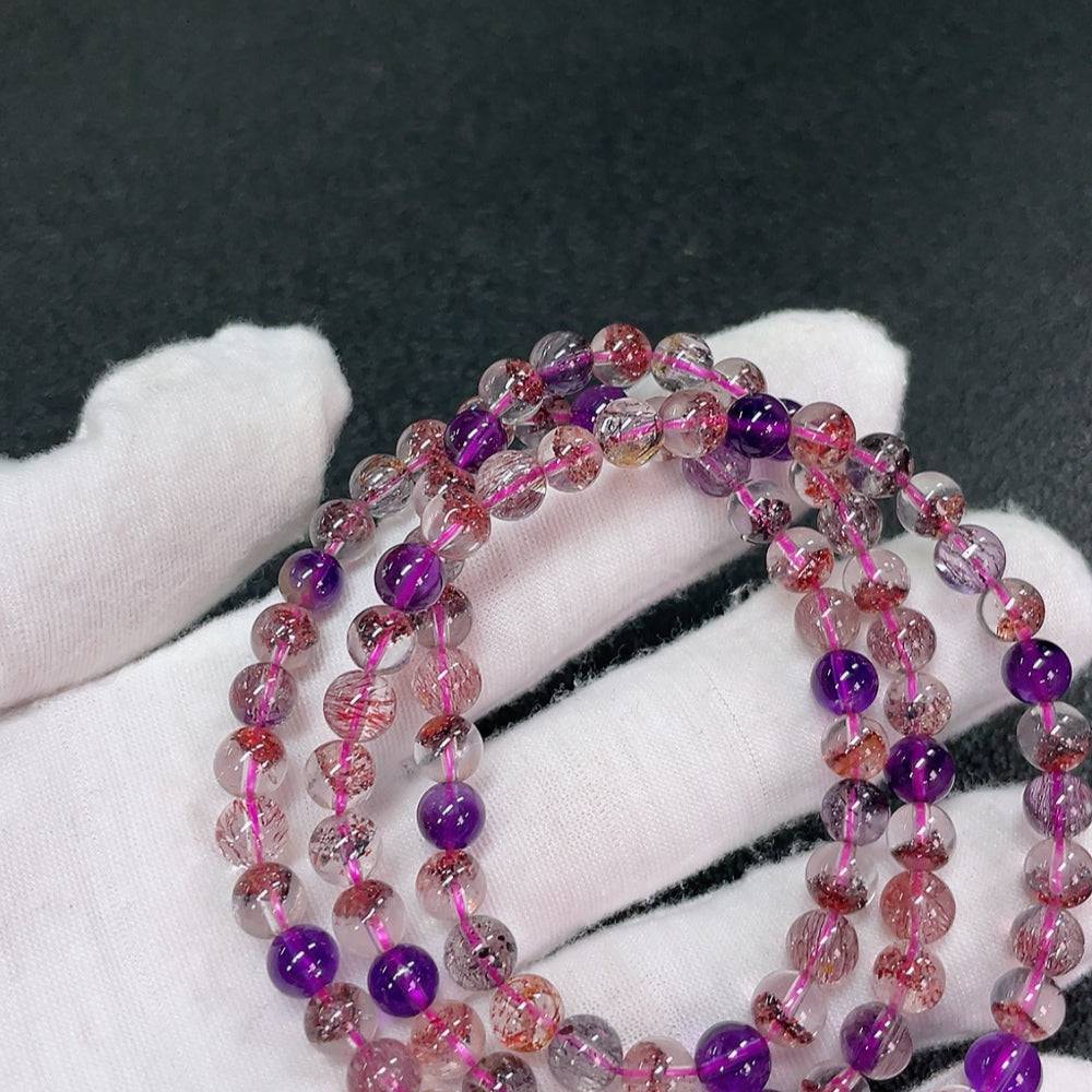 Huiliu gemstone crystal bead strand with 6.1mm size, featuring transparent, polished crystals arranged in a continuous strand.