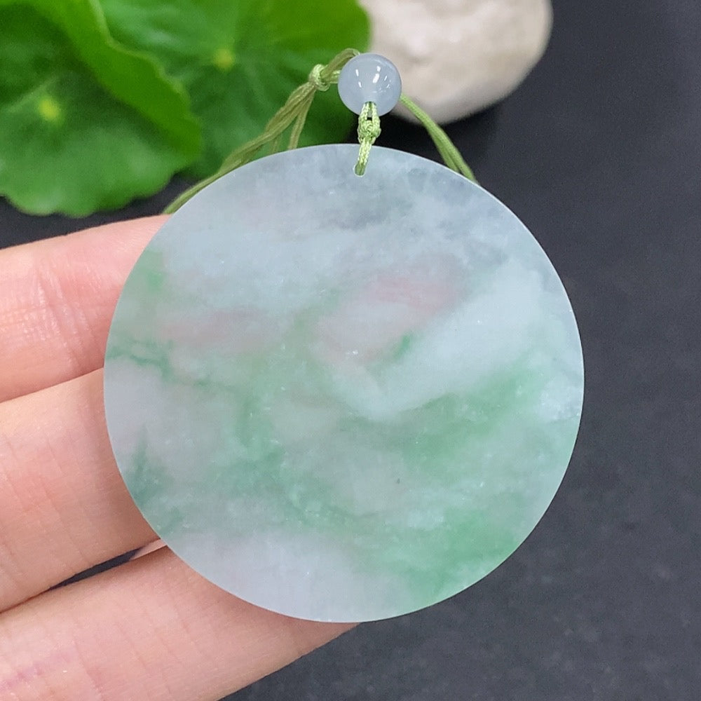Smooth jadeite plain pendant with a polished finish, showcasing a natural green jade stone on a simple cord.