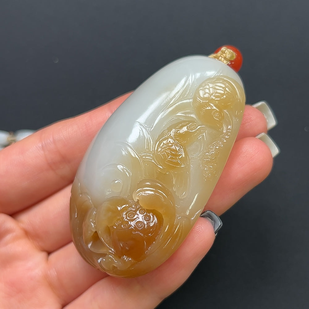 Hetian Jade "Joy on the Brow" pendant necklace with non-Hetian beads, featuring a detailed jade pendant on a beaded necklace.