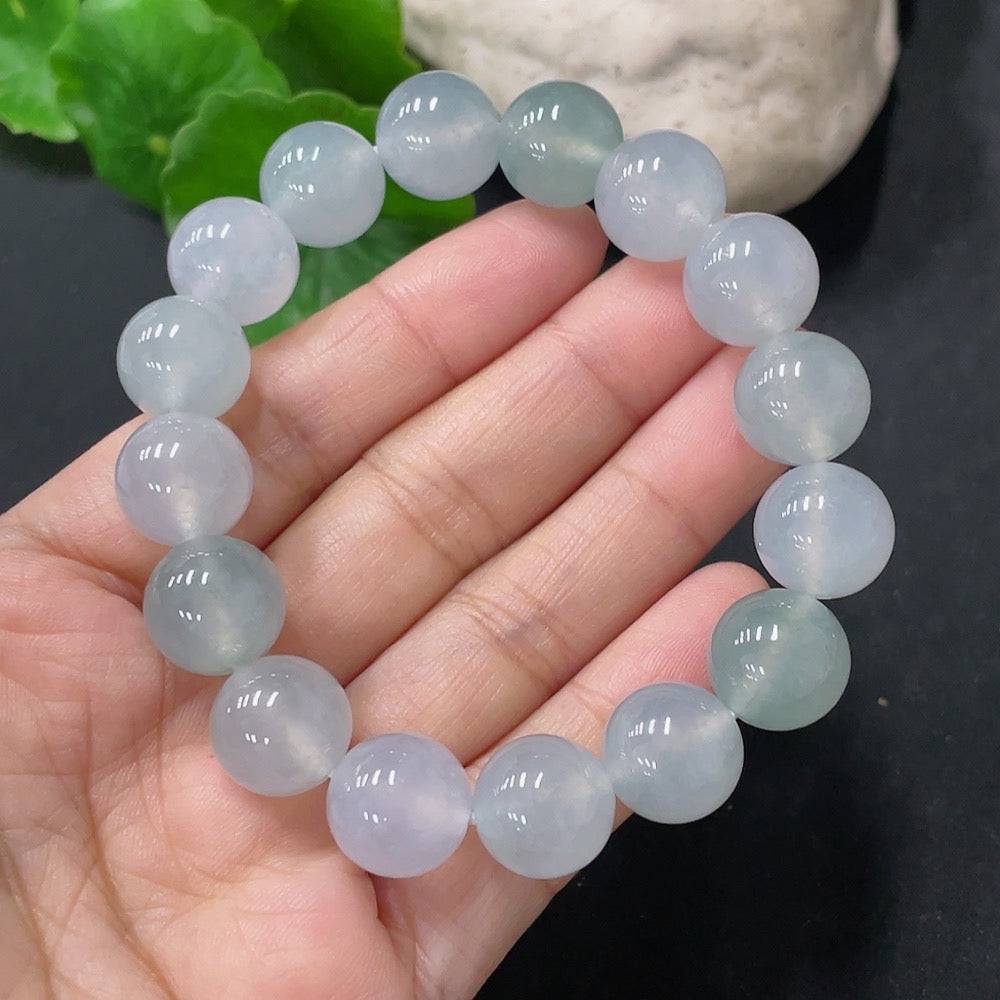 HUILIU HQ jadeite bracelet with 12mm beads, weighing approximately 47.72 grams, showcasing smooth, polished green jade stones.