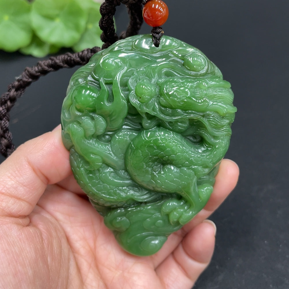 Huiliu Certified Hetian Jade hand-carved dragon figurine, detailed jade carving with intricate dragon design.
