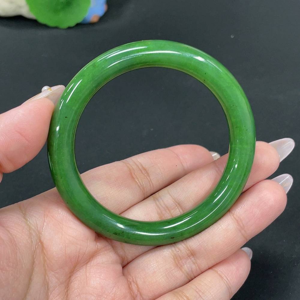 Green Hetian Jade round bangle by HUILIU HQ, 55.7mm size, weighs approx. 41.8g, showcasing smooth polished jade surface.