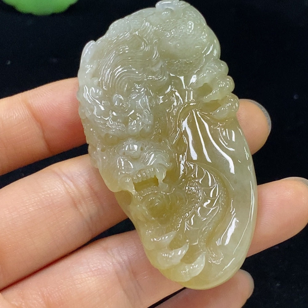 Jadeite dragon pendant in green jade with detailed carving, weighs approximately 34.71g, from HKHQ.