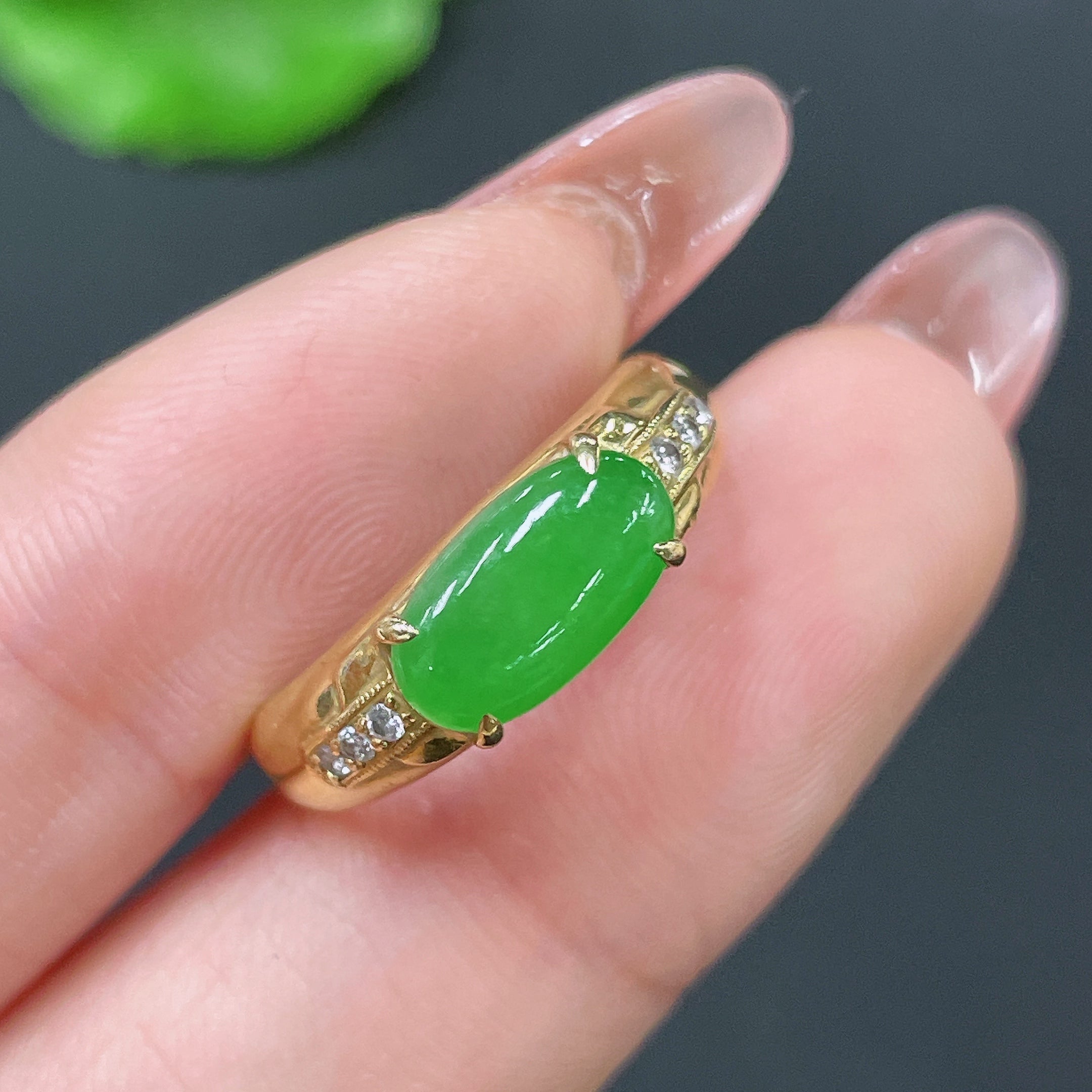 Jadeite ring with 18k gold setting and diamond accent, size 12, from HUILIU HQ, featuring a polished green jade gemstone.