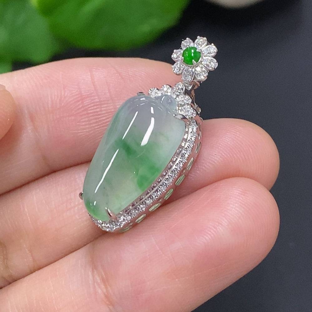 Jadeite pendant with 18K gold setting, accented with diamonds, weighs approx. 3g, featuring a smooth green jade stone.