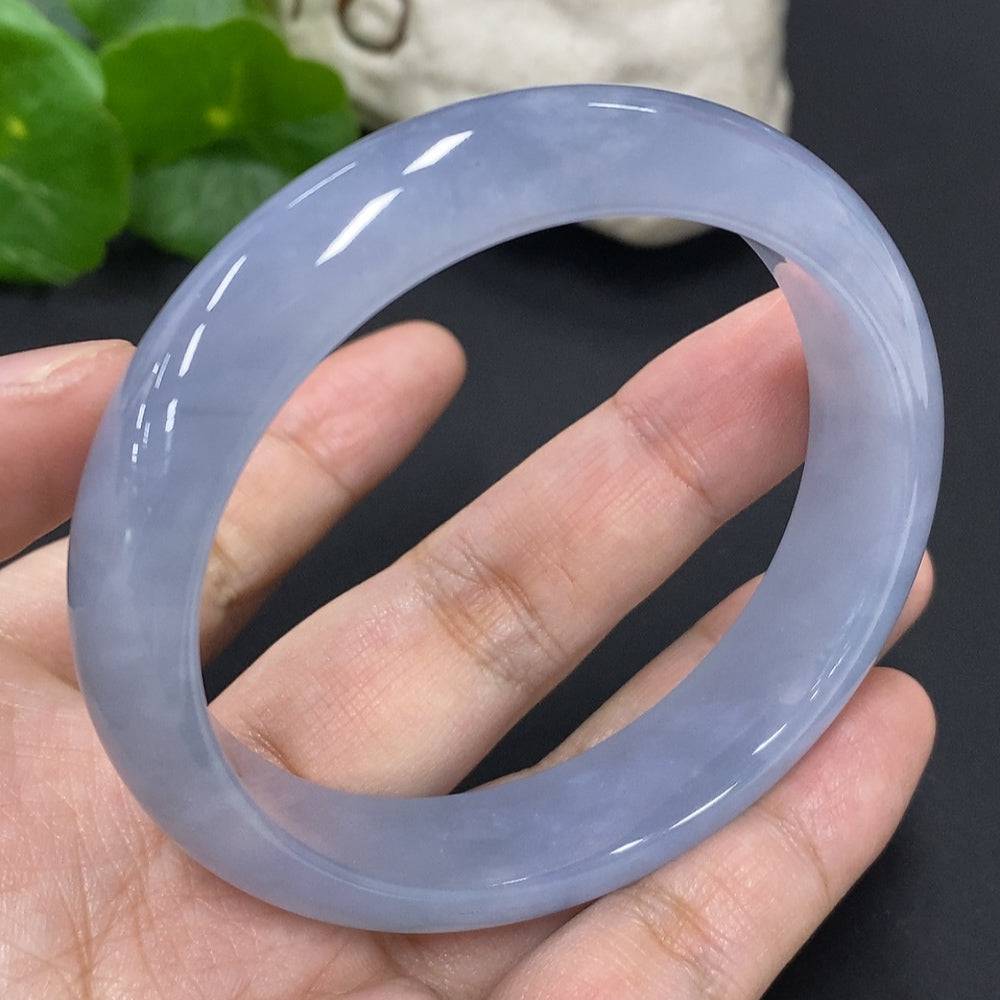 Jadeite round bangle bracelet in size 57.3 with approximately 56.3g weight, crafted by HUILIU HQ, showcasing smooth, polished jade.