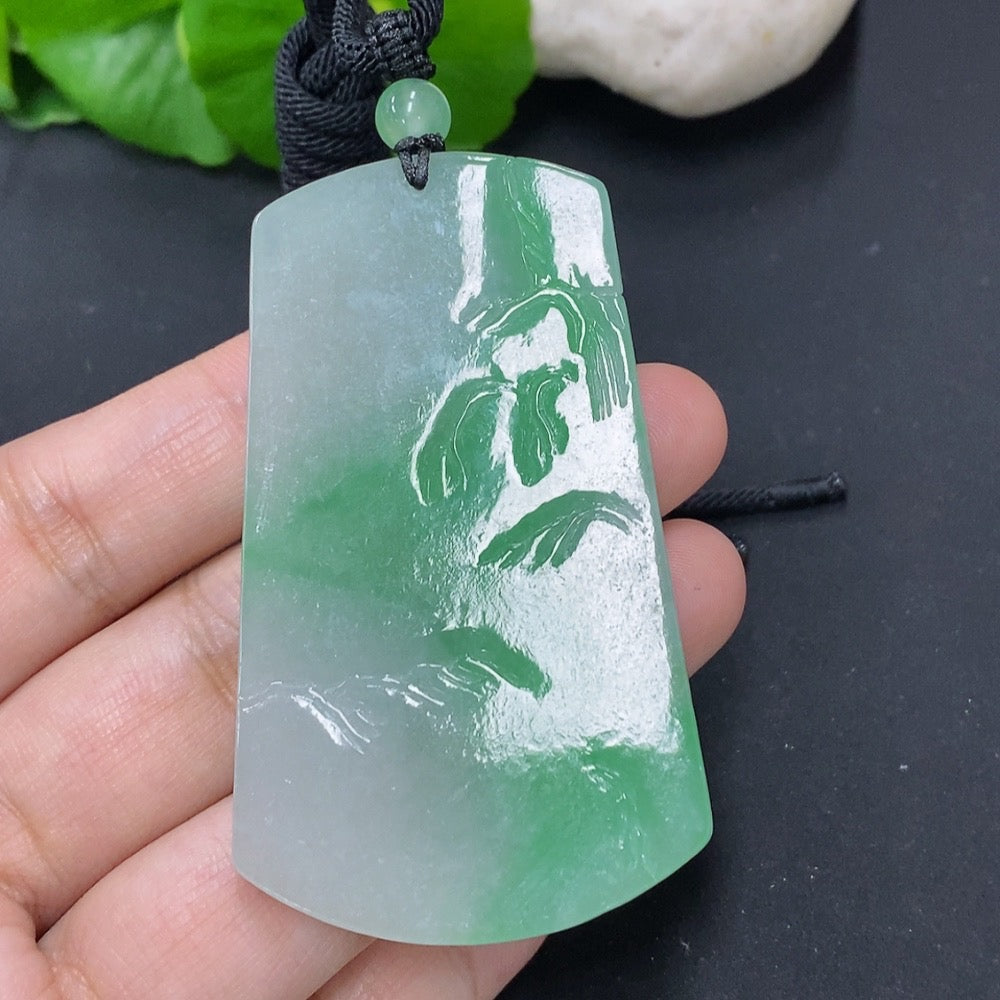 Jadeite pendant with landscape design from HKHQ, weighing 36.4g, featuring a cord for wearing, smooth polished surface.