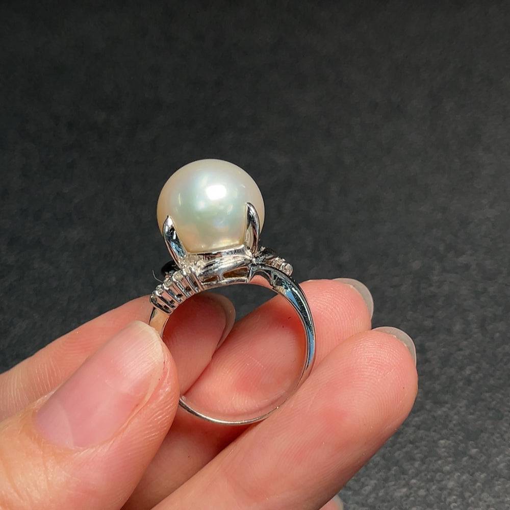 HUILIU HQ seawater pearl ring with diamond accent, featuring pearl and diamond stones in a polished silver band.