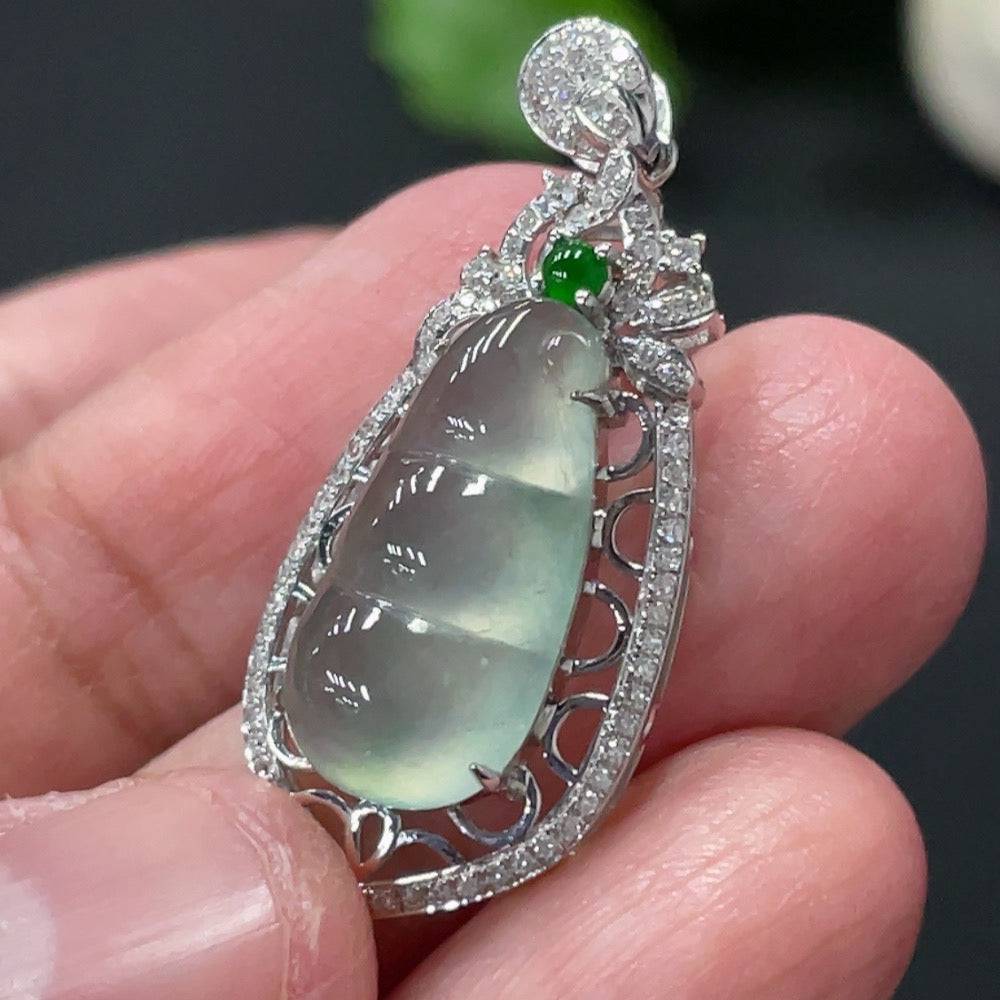 Jadeite blessing bean pendant with 18K gold setting and diamond accents, crafted by HUILIU HQ, weighing approximately 2.79g.