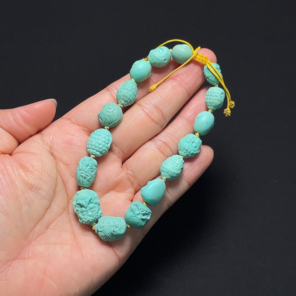 Turquoise bracelet from HKHQ featuring round turquoise beads on an adjustable cord, stylish and vibrant accessory for any outfit.
