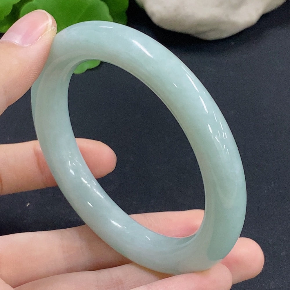 HKHQ jadeite round bangle in size 55.1, weighing 56.12g, showcasing smooth, polished green jadeite bracelet with a glossy finish.