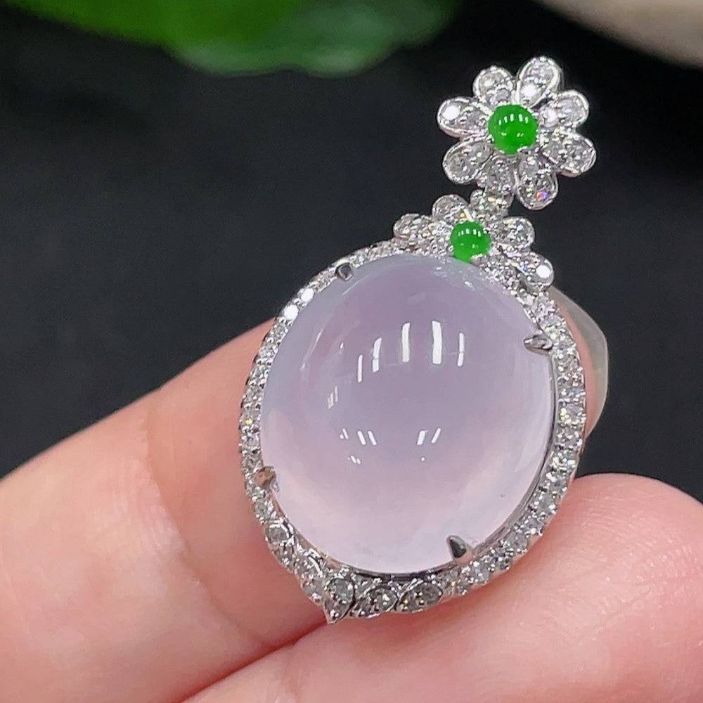 Jadeite pendant with 18K gold setting and diamond accents, shown on a jewelry display. Crafted by HUILIU HQ.