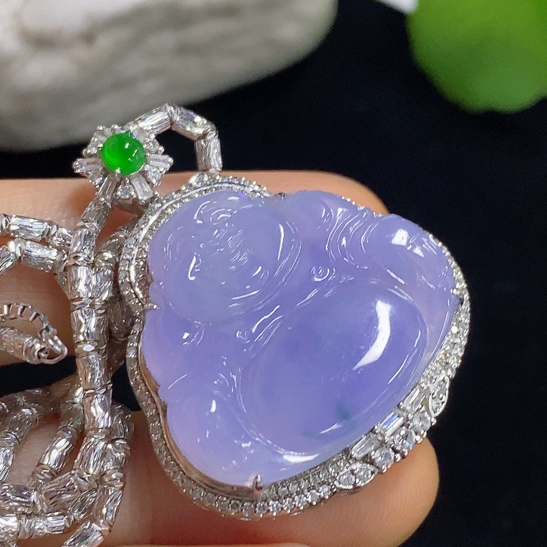 Jadeite Buddha pendant necklace with 18K gold and diamond accents, showcasing detailed craftsmanship and elegant design.