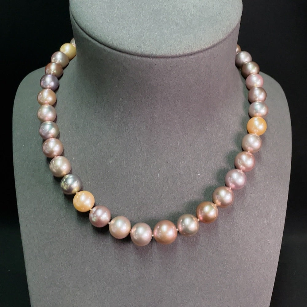 Elegant strand of non-gold pearl necklaces by HKHQ, showcasing lustrous white pearls on a delicate string.