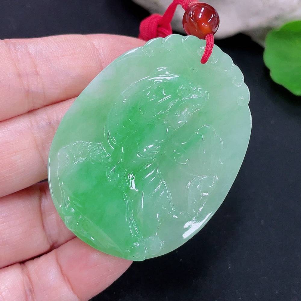 Jadeite tiger on mountain pendant by HUILIU HQ featuring a detailed jade carving of a tiger and mountain scene.