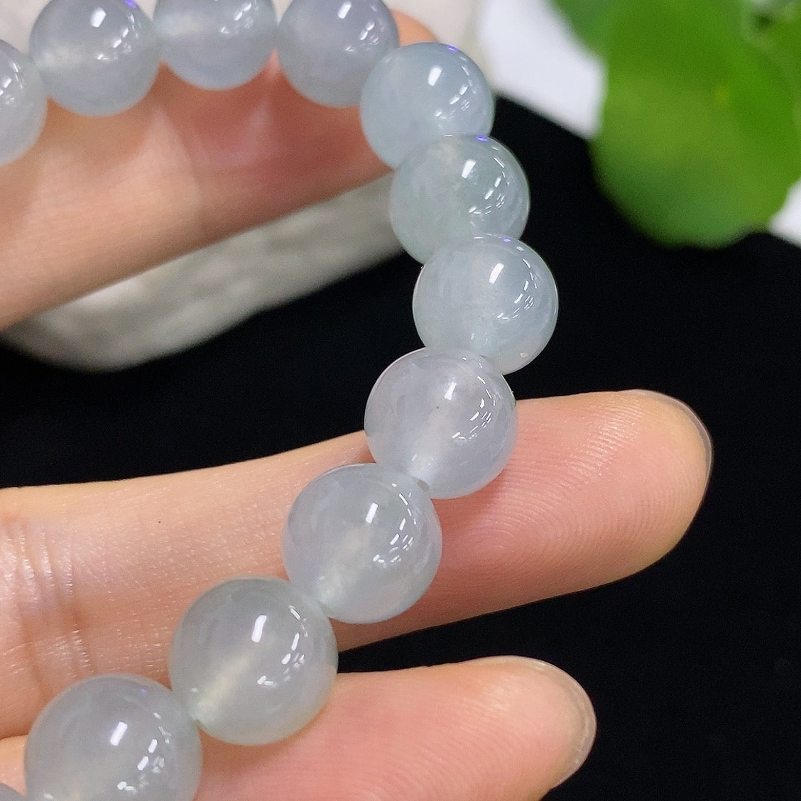 HKHQ jadeite bracelet weighing 28.68g, featuring smooth, polished green jadeite beads on a durable string.