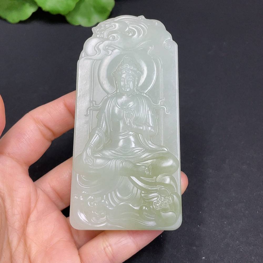 Huiliu certified Hetian jade pendant featuring Guanyin figure, smooth polished surface, hanging from a silk cord.