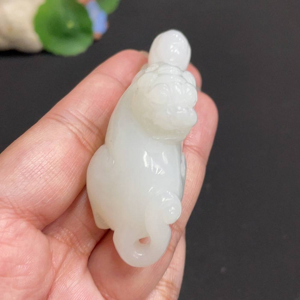 Hetian jade pendant featuring an auspicious beast design with non-Hetian jade beads and rope, weight approx. 65.3g.