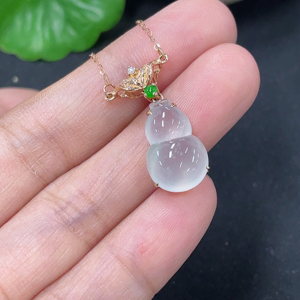 Jadeite inlaid gourd pendant with 18K gold and diamond accents, elegant necklace featuring intricate craftsmanship.