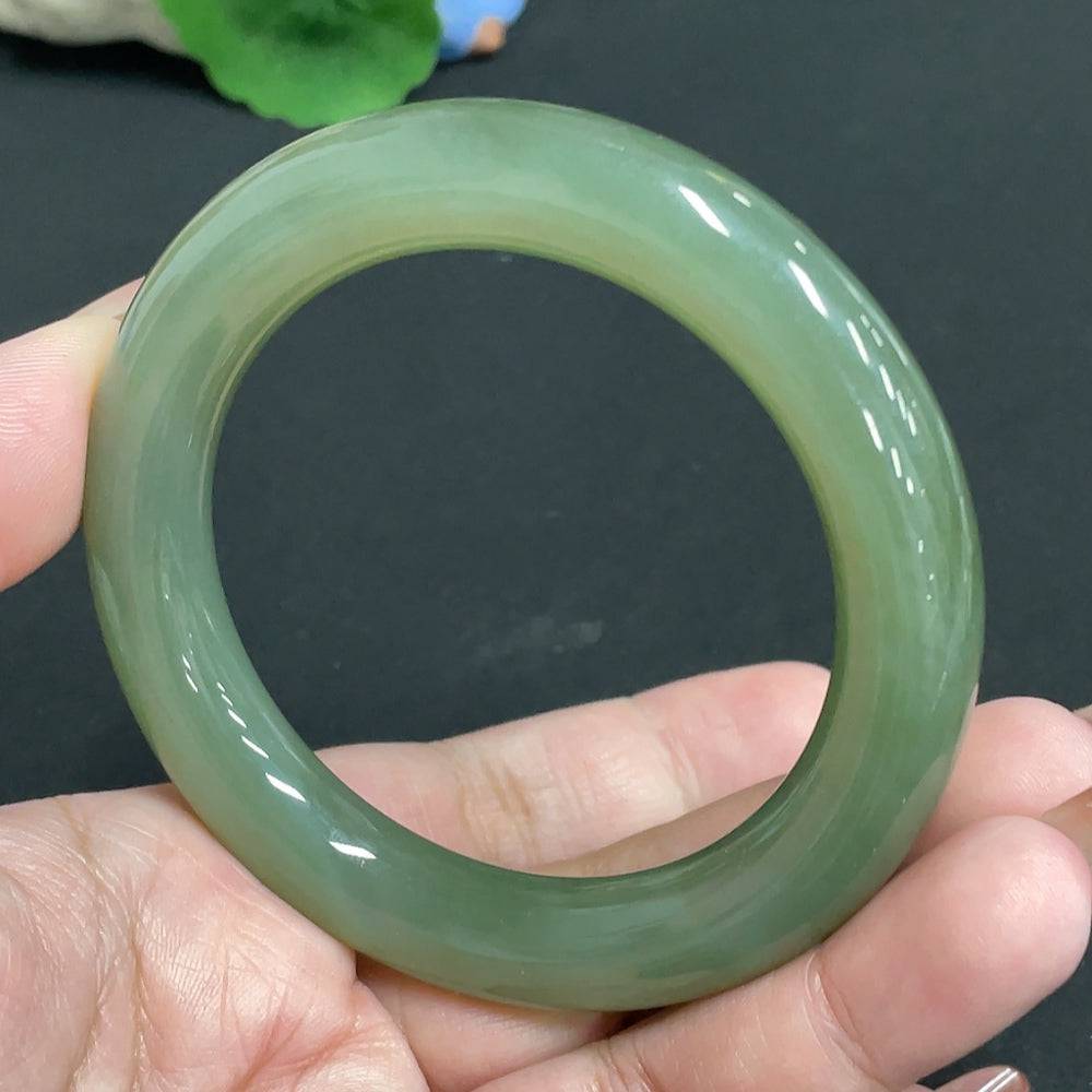 HUILIU HQ Hetian Jade round bangle with size 56.7, weighing approximately 63.7g, showcasing smooth polished jade surface.