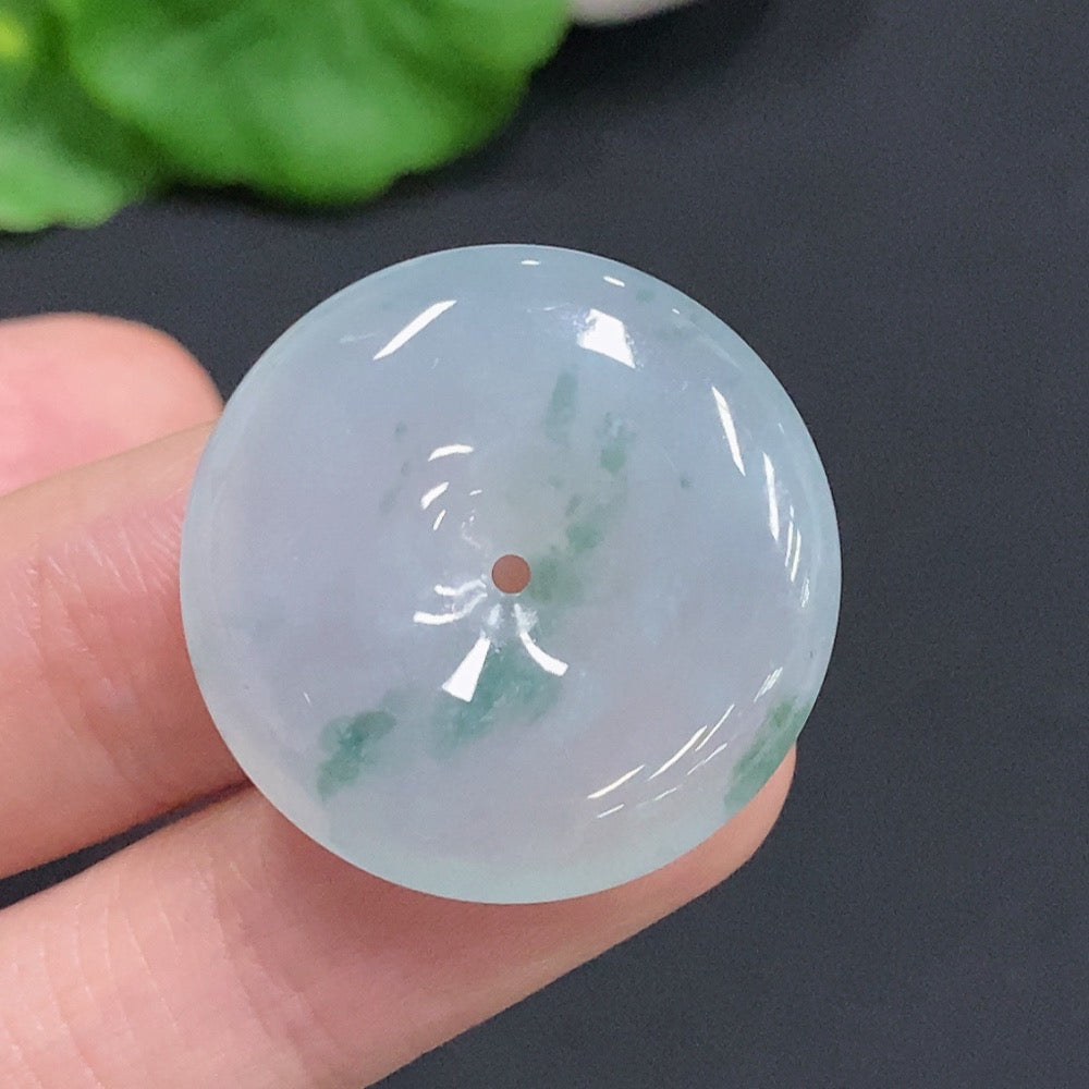 Jadeite Peace Knot pendant from HUILIU HQ, approximately 7.4g, with intricate carved design and smooth polished surface.