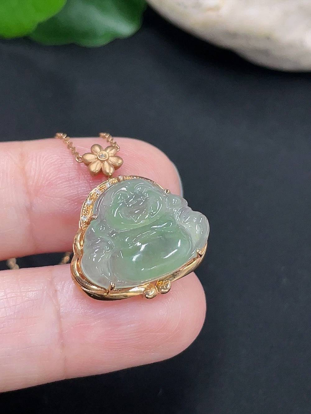 Jadeite Buddha pendant with 18K gold chain, diamond accent, and a single non-diamond stone, weighing approximately 3g.