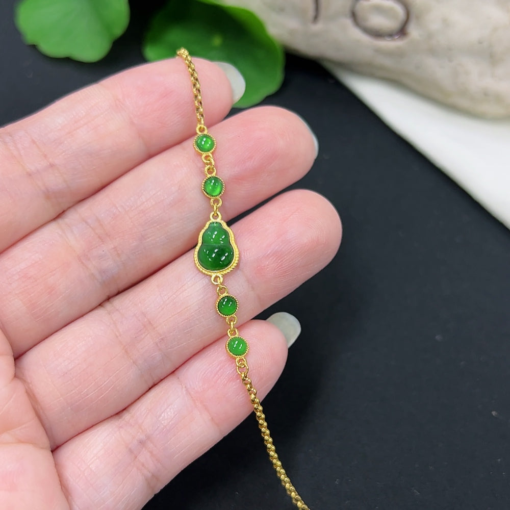 Jadeite inlaid bracelet with 18K gold accents, lightweight design, crafted by HKHQ, featuring smooth jade stones and intricate gold detailing.