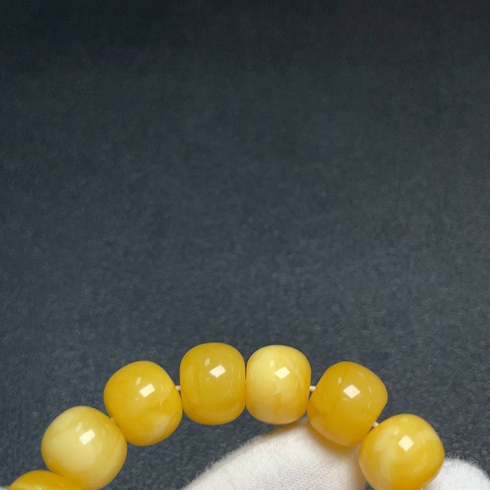 Huiliu Amber Beeswax bracelet with Southern Red Agate beads, natural amber jewelry with intricate details and warm tones.