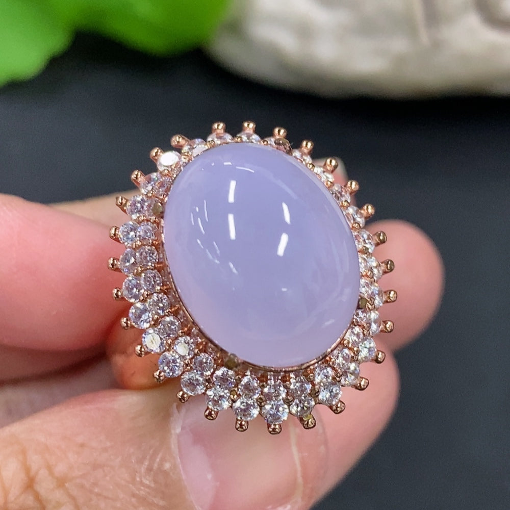 Jadeite cabochon with non-gold inlay, weighing approximately 20.8g, from HKHQ, showcasing smooth, polished jade surface.