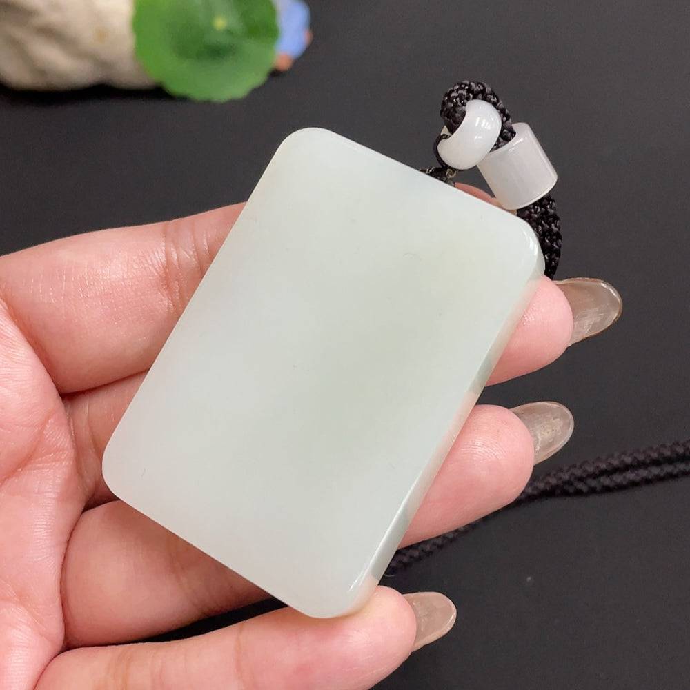 Huiliu certified Hetian jade pendant with a smooth plain design, showcasing elegant green jade craftsmanship.