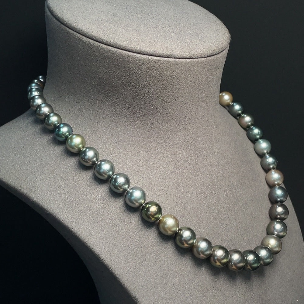 Seawater pearl strand with non-gold setting, 8.4-11.5mm size, approx. 65.82g, showcasing lustrous white pearls on a jewelry display