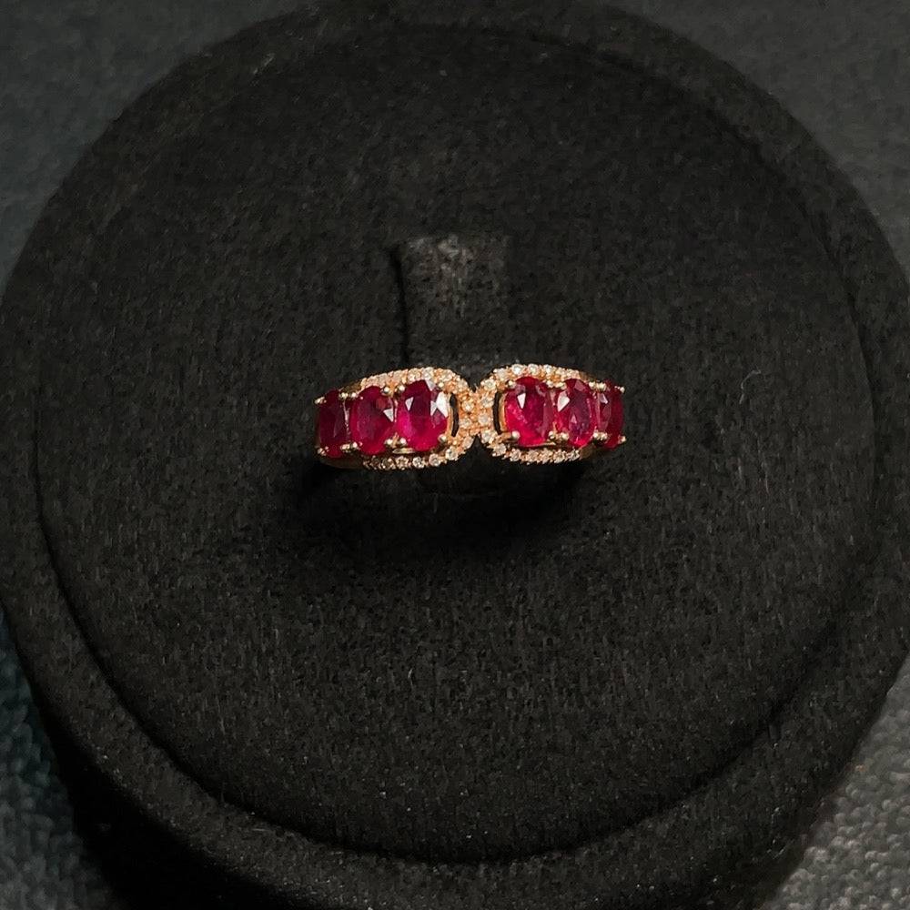 Huiliu gemstone ruby ring with filled design and diamond accents, showcasing a vibrant red gemstone and elegant craftsmanship.