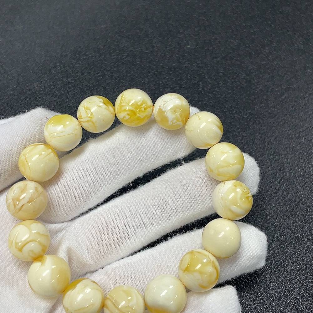 Amber Beeswax Bracelet by HUILIU HQ featuring 12.3mm amber beads, natural beeswax appearance, and certified quality.