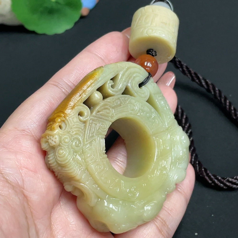 Huiliu HQ antique style Hetian Jade handheld carving with intricate design, showcasing smooth, polished jade craftsmanship.
