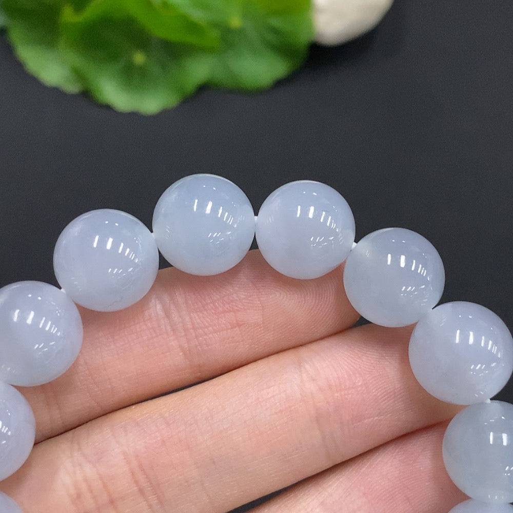 HUILIU HQ jadeite bracelet weighing 50.3g with 12mm beads, showcasing smooth, polished green jade stones.