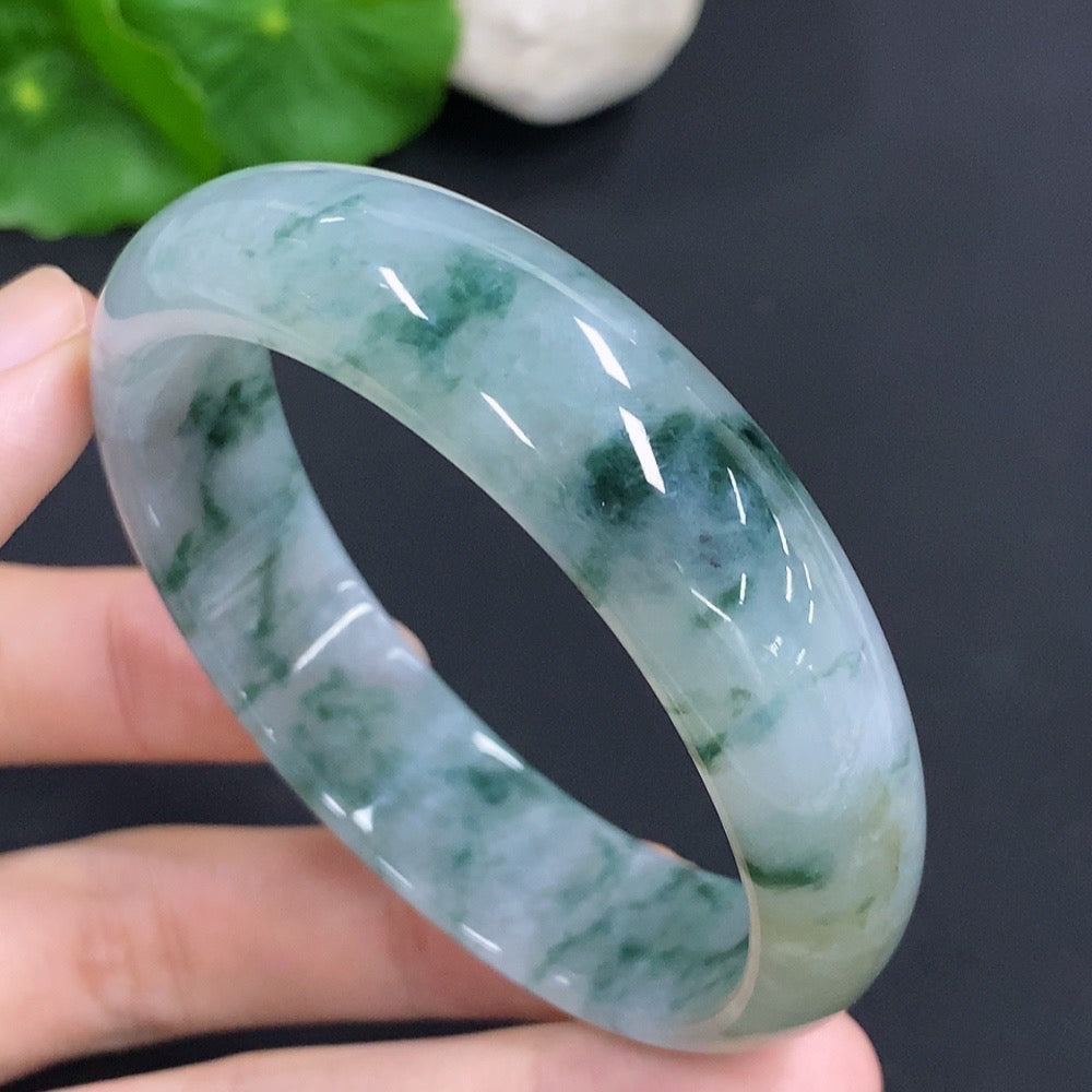 HKHQ jadeite oval bangle in size 58.8 with a 47.7g weight, showcasing smooth, polished green jadeite jewelry.