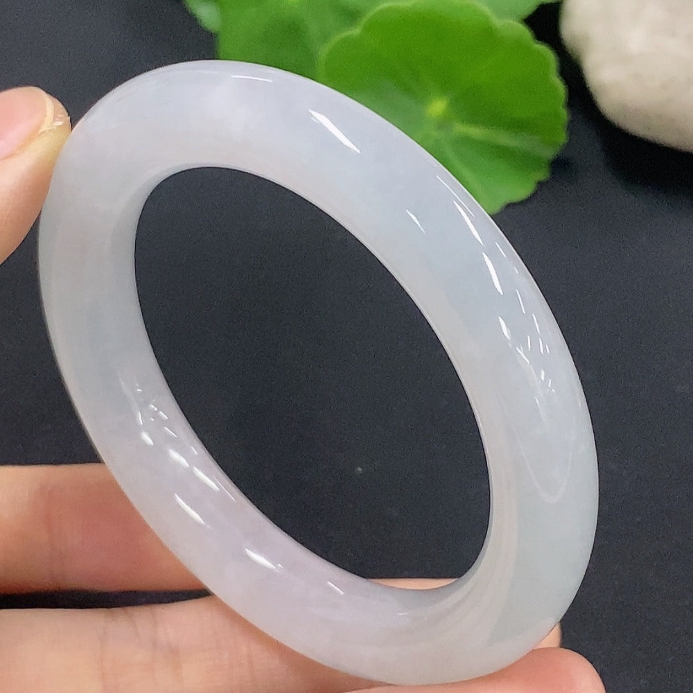Jadeite round bangle in size 50.2 with approximate weight of 50.18g, crafted by HKHQ, showcasing smooth, polished jade jewelry.