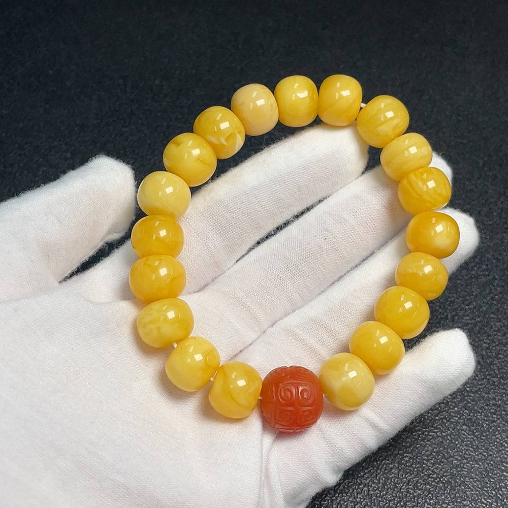 HUILIU HQ Amber beeswax bracelet with a Southern Red Agate bead, natural amber jewelry, handcrafted and certified by Huiliu.