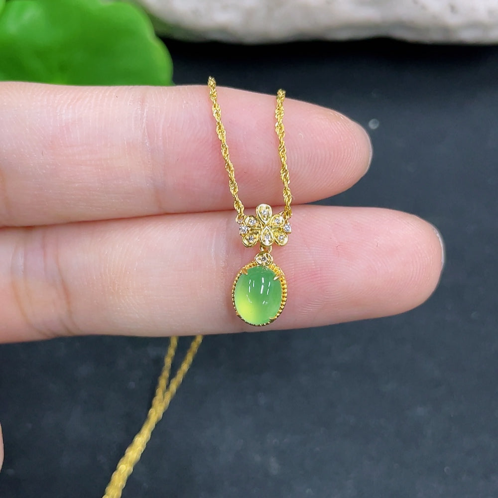 Jadeite pendant with 18k gold and diamond accents, includes chain, weighing approximately 1.08g, from HKHQ.