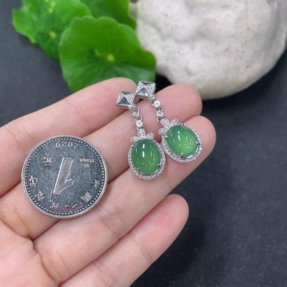 Jadeite inlaid earrings with 18K gold and diamond accents, designed by HKHQ, showcasing intricate craftsmanship and elegant style.