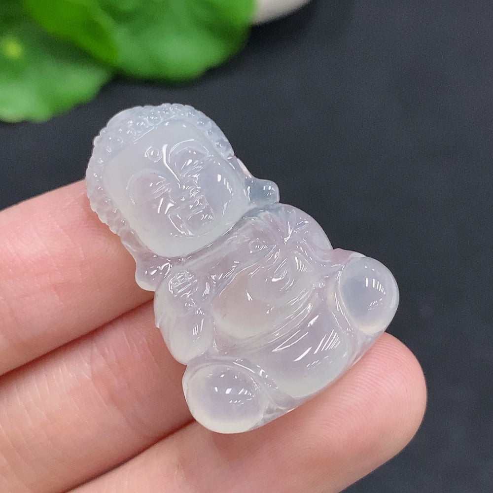 Jadeite baby Buddha pendant with green jade, weighing approximately 7.5g, featuring intricate carved details on smooth jade surface.