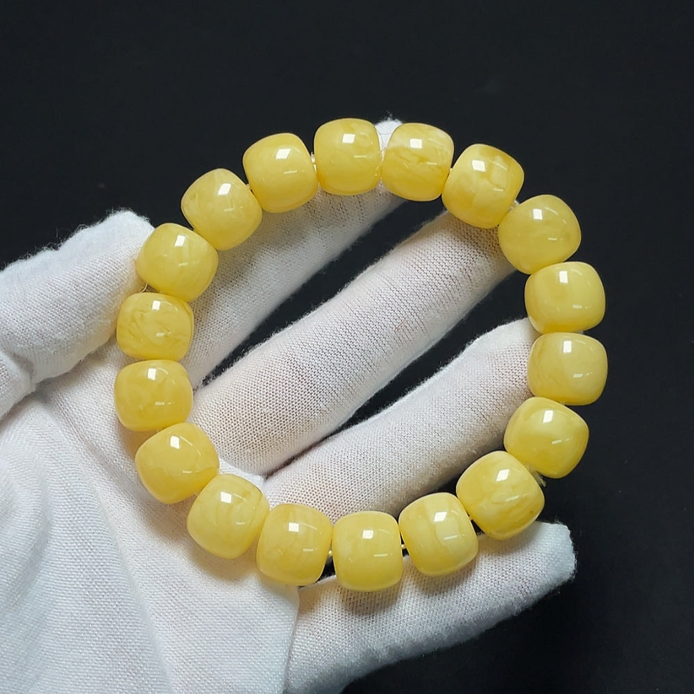 Amber Beeswax bracelet by HKHQ featuring natural beeswax beads on an elastic band, weighing 26.18g.