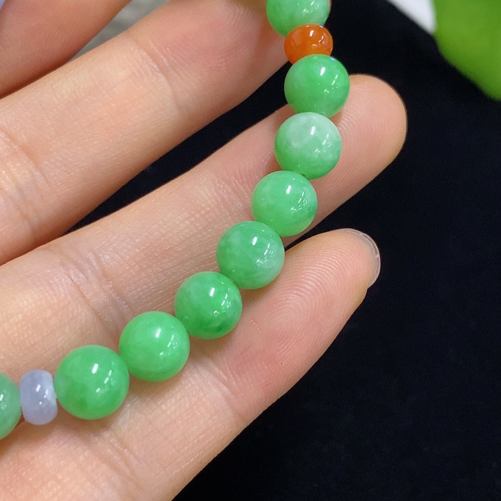 HKHQ jadeite bracelet with red beads, 7.3/5.2mm size, approximately 15.05g, natural jade jewelry with vibrant red accents.