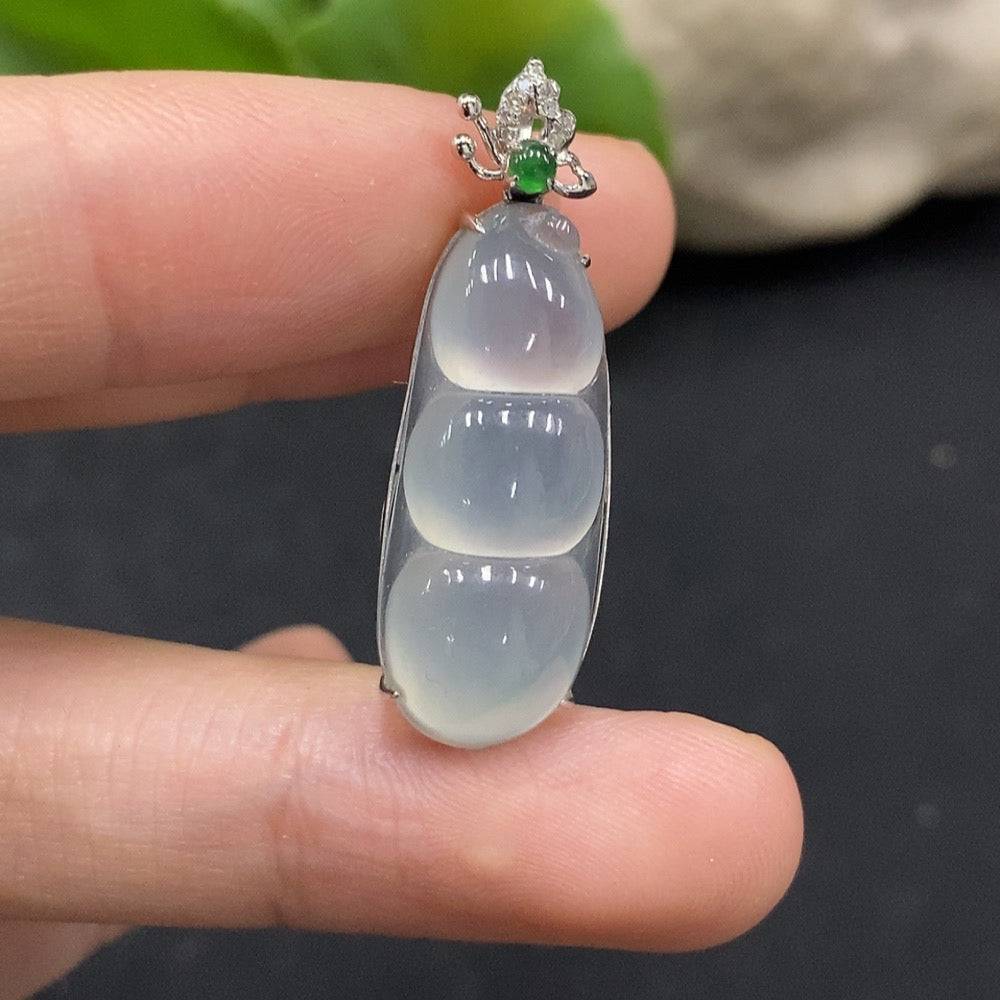Jadeite lucky bean pendant with 18K gold and diamond accents, showing the detailed gemstone and elegant design.