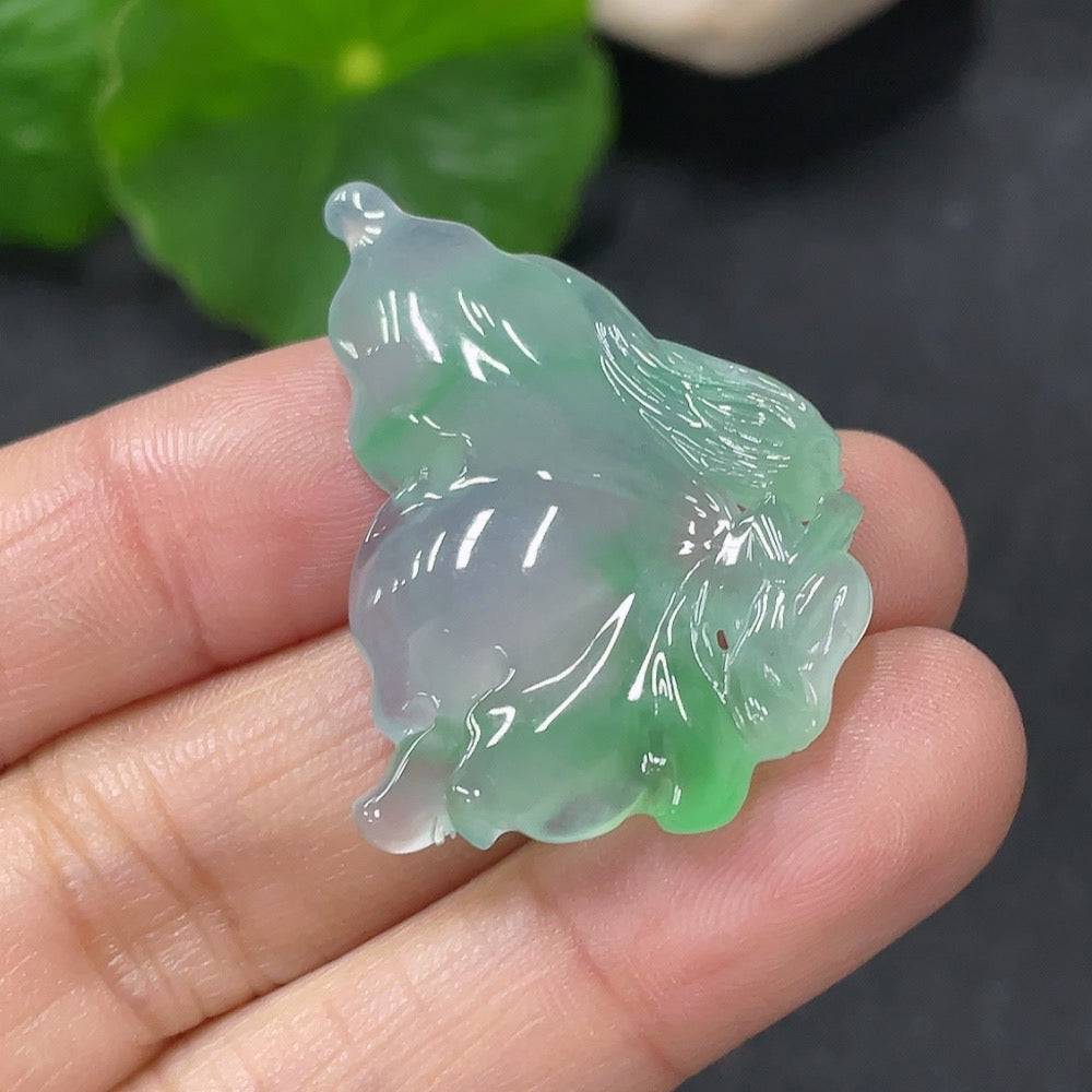 Jadeite pendant shaped like a butterfly fairy featuring smooth green jade with intricate carved details, crafted by HUILIU HQ.